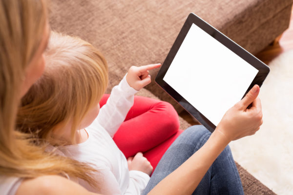 Mother and daughter looking at tablet